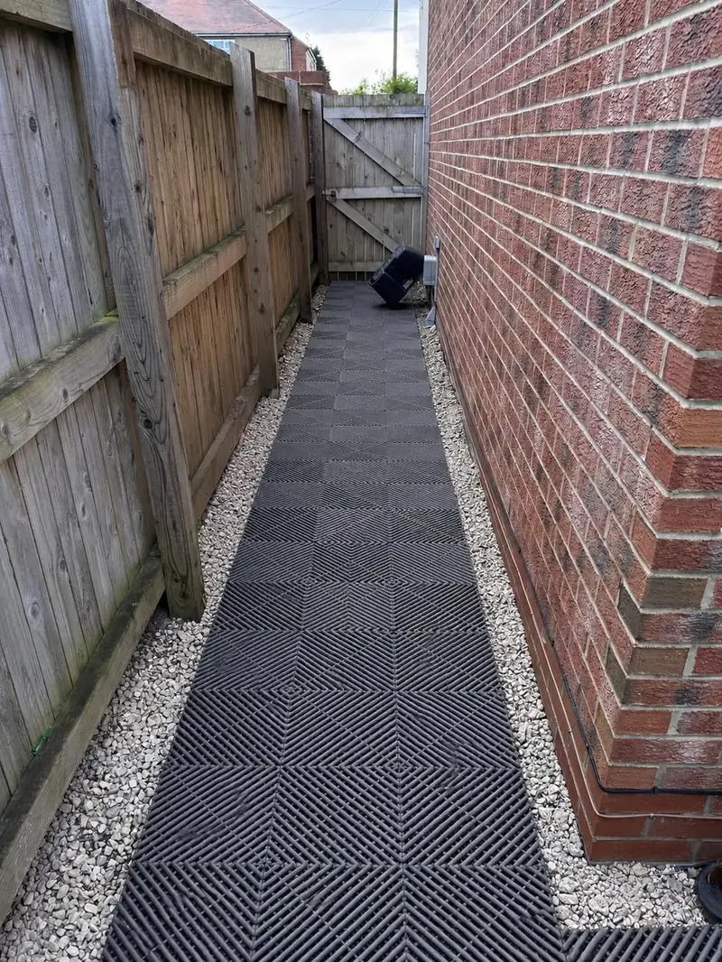 Garden pathway with modular interlocking floor tiles
